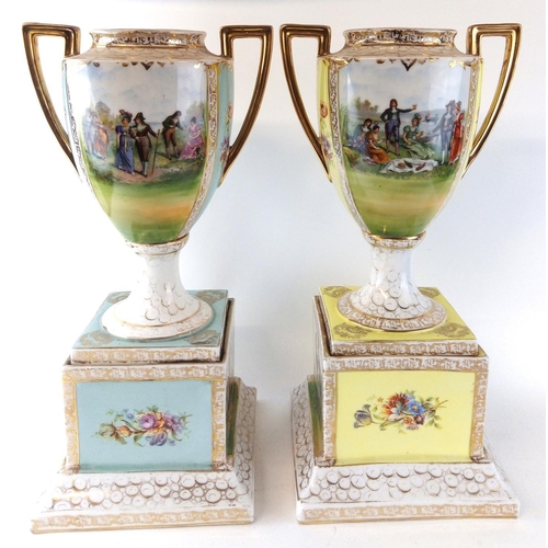 444 - A LARGE PAIR OF EARLY 20TH CENTURY AUSTRIAN PORCELAIN PEDESTAL VASES
Campagna form with twin gilt ha... 