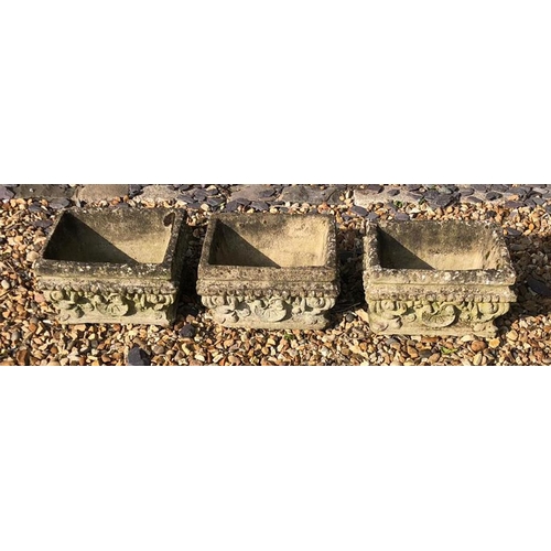 453 - A SET OF THREE RECONSTITUTED WEATHERED RECTANGULAR PLANTERS
With shell form decoration. 
(approx 33c... 