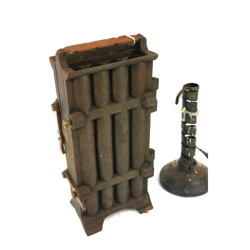 456 - AN 18TH CENTURY IRON RUSH LIGHT HOLDER ON WOODEN BASE 
Along with a cast iron eight section candle m... 