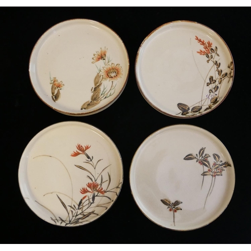 460 - A SET OF FOUR EARLY 20TH CENTURY JAPANESE PORCELAIN SHALLOW BOWLS
Each hand painted with asymmetrica... 