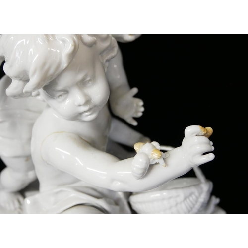 462 - A LARGE EARLY 20TH CENTURY ITALIAN WHITE GLAZE PORCELAIN FIGURAL GROUP
Two children at play with ins... 