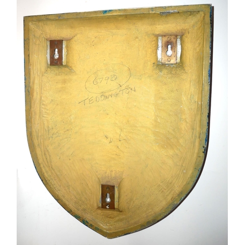 466 - A MID 20TH CENTURY CAST ALUMINIUM AND ENAMEL SHIELD
Bearing the coat of arms for Teddington.
(38cm x... 