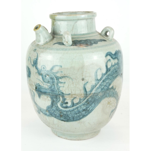 472 - A CHINESE PROVINCIAL MING PERIOD RICE WINE JUG
Decorated with a four toe dragon on a pale blue groun... 