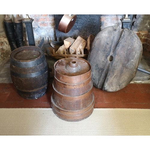 473 - AN EARLY 20TH CENTURY TRUMAN IRON BOUND BARREL
Along with a wooden churn and a large wooden rope blo... 