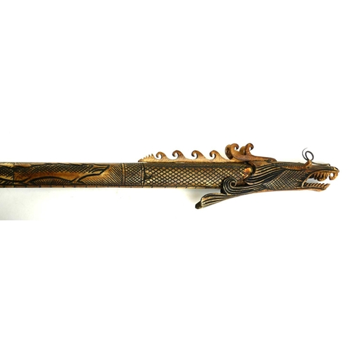 475 - A POLYNESIAN CARVED BONE STAFF
Carved with a dragon.
(90cm)

Condition: good