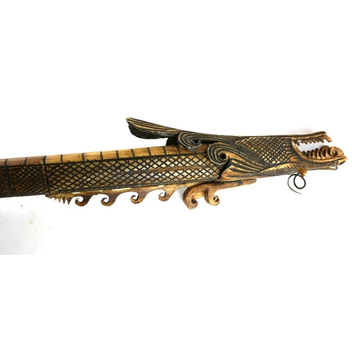 475 - A POLYNESIAN CARVED BONE STAFF
Carved with a dragon.
(90cm)

Condition: good