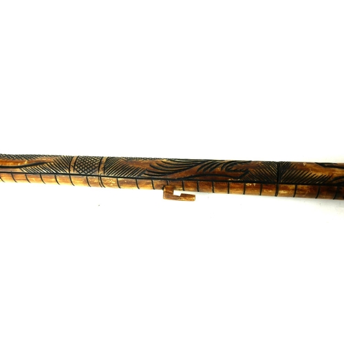 475 - A POLYNESIAN CARVED BONE STAFF
Carved with a dragon.
(90cm)

Condition: good