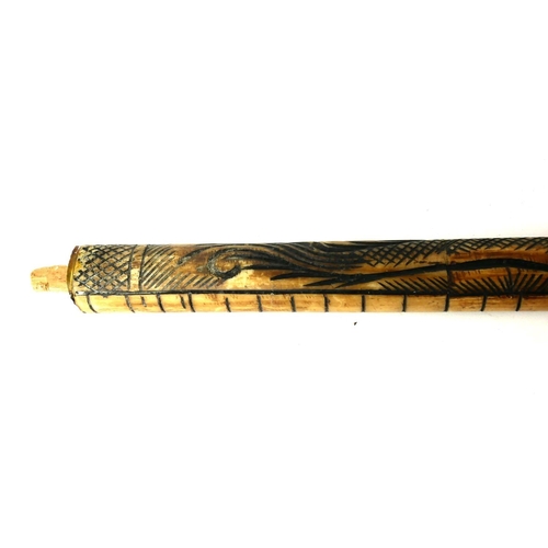 475 - A POLYNESIAN CARVED BONE STAFF
Carved with a dragon.
(90cm)

Condition: good