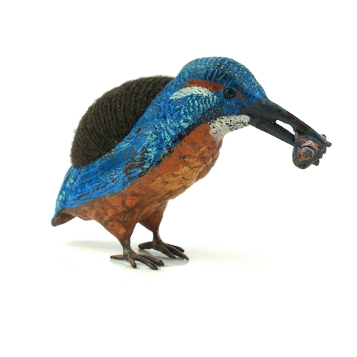 482 - A COLD PAINTED METAL KINGFISHER
With fish to beak and velvet cushion to back. 
(approx 14cm x 7cm)