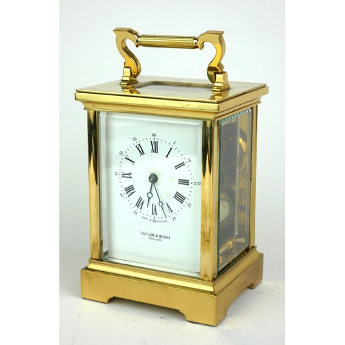 489 - TAYLOR AND BLIGH, A LARGE 20TH CENTURY GILT BRASS CARRIAGE CLOCK Having a single carry handle, visua... 