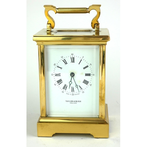 489 - TAYLOR AND BLIGH, A LARGE 20TH CENTURY GILT BRASS CARRIAGE CLOCK Having a single carry handle, visua... 