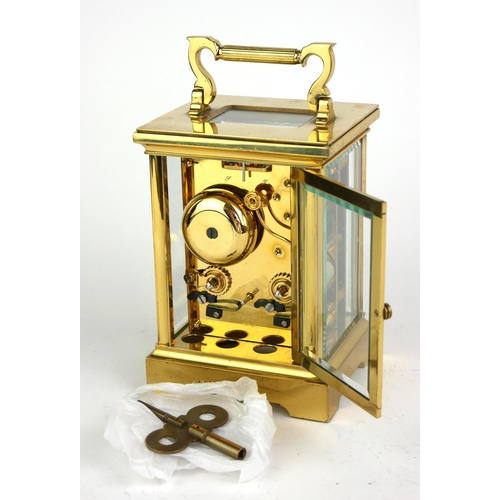 489 - TAYLOR AND BLIGH, A LARGE 20TH CENTURY GILT BRASS CARRIAGE CLOCK Having a single carry handle, visua... 