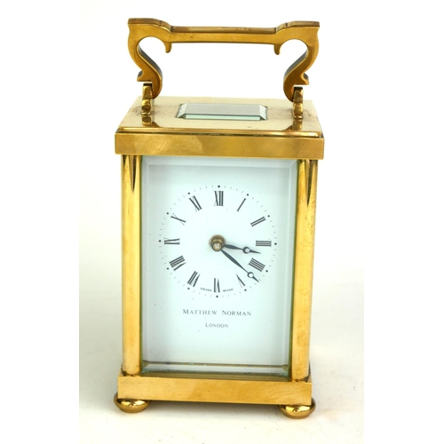 490 - MATHEW NORMAN, A 20TH CENTURY  GILT BRASS CARRIAGE CLOCK
Having a single carry handle, visual escape... 