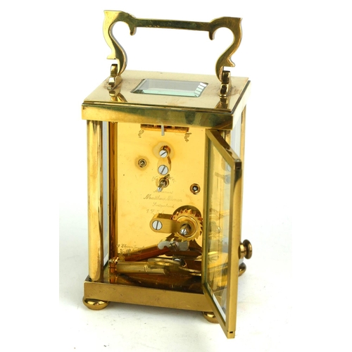 490 - MATHEW NORMAN, A 20TH CENTURY  GILT BRASS CARRIAGE CLOCK
Having a single carry handle, visual escape... 