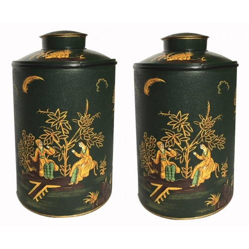 496 - A PAIR OF CHINESE TOLEWARE TEA CANISTERS
The circular lids with chinoiserie decoration on green grou... 