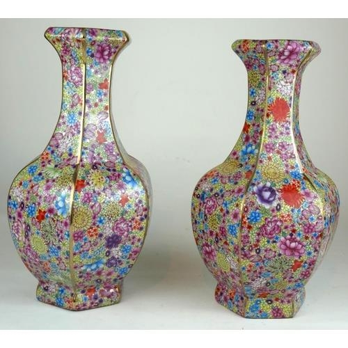 499 - A PAIR OF CHINESE PORCELAIN FLORAL VASES
Decorated with multi flowers on yellow ground with jade gre... 