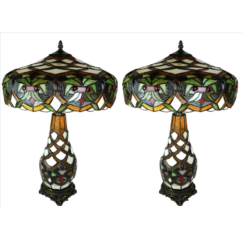 501 - A PAIR OF LARGE TIFFANY STYLE LEADED GLASS TABLE LAMPS
In ‘Sunset’ pattern, with various leaf design... 