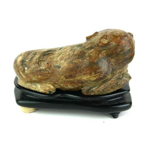 506 - AN ANTIQUE CHINESE  SOAPSTONE SCULPTURE OF A RECUMBENT LIONESS
Carved decoration of protruding front... 