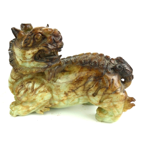 507 - A CHINESE JADEITE SCULPTURE OF A TEMPLE DOG/KYLIN
Carved in standing pose looking to rear, together ... 