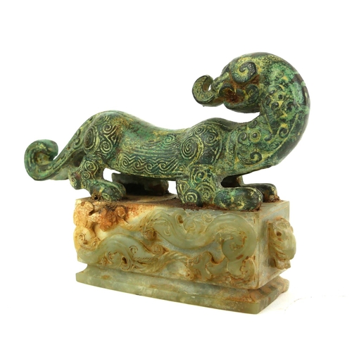 508 - A CHINESE ARCHAIC DESIGN BRONZE AND HARDSTONE SCULPTURE OF A DRAGON 
Engraved and raised decoration,... 