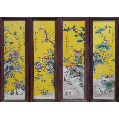 509 - A SET OF FOUR ORIENTAL PORCELAIN PLAQUES 
Decorated in traditional manner with flora and fauna, on y... 