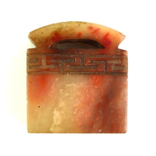 511 - A CHINESE CARVED SOAPSTONE SEAL
Archaic design with rectangular carved seal to base. 
(approx 4cm x ... 