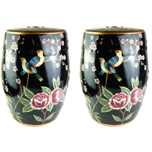 521 - A PAIR OF 20TH CENTURY FAMILLE NOIR STYLE PORCELAIN GARDEN BARREL SEATS
Painted with birds and flora... 