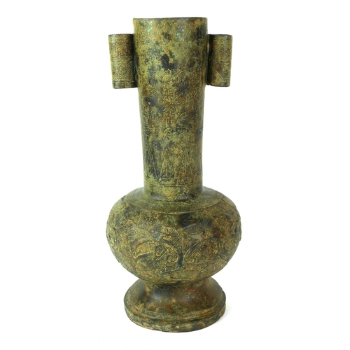 522 - AN ORIENTAL ARCHAIC SHAPED BRONZE ARROW VASE
Decorated with script and foliage. 
(h 28cm)