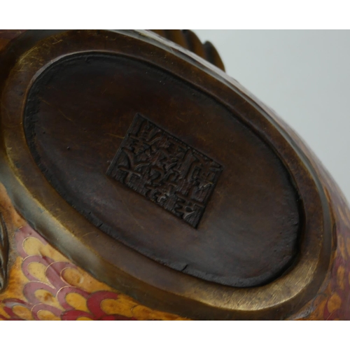 533 - A 20TH CENTURY ORIENTAL BRONZE AND CLOISONNÉ CARP CENSER 
With red and brown glazes.
(length 30cm x ... 