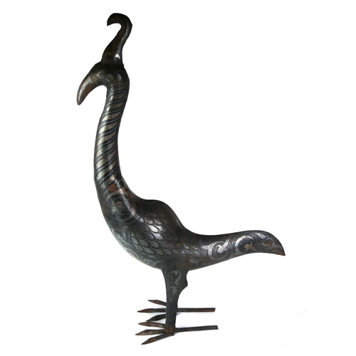 536 - A PERSIAN STYLE METAL MODEL OF A PEACOCK
Inlaid with white metal bands.
(h 61cm)