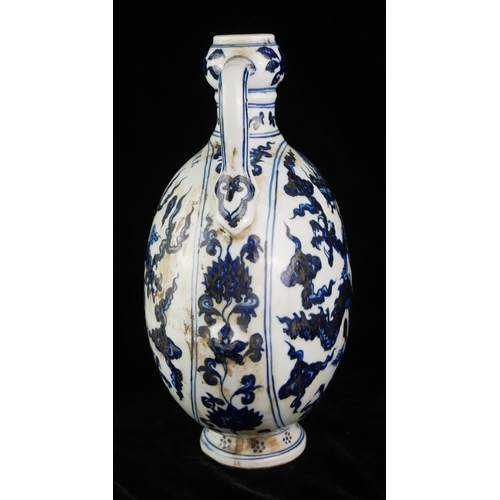 537 - A 20TH CENTURY CHINESE BLUE AND WHITE PORCELAIN MOON FLASK
Both sides decorated with Imperial dragon... 