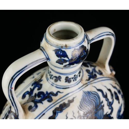 537 - A 20TH CENTURY CHINESE BLUE AND WHITE PORCELAIN MOON FLASK
Both sides decorated with Imperial dragon... 