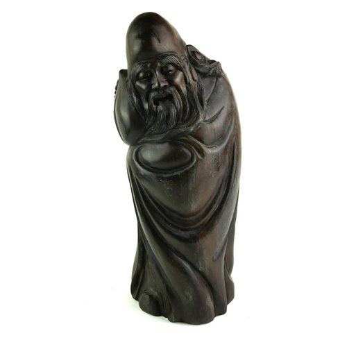 541 - A CHINESE ROSEWOOD FIGURE OF A SCHOLAR WITH PEACH
Standing pose with carved with elongated head, lon... 