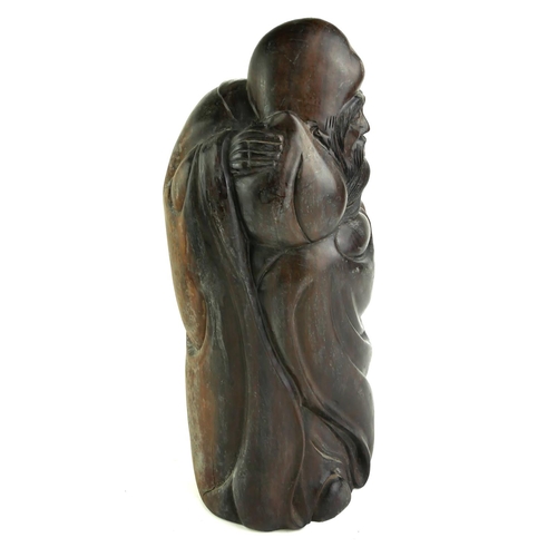 541 - A CHINESE ROSEWOOD FIGURE OF A SCHOLAR WITH PEACH
Standing pose with carved with elongated head, lon... 