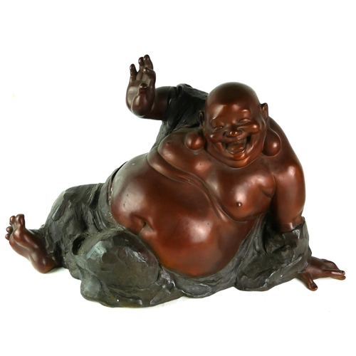 546 - A LARGE BRONZE MODEL OF A BUDDHA IN HAPPY MEDITATION TECHNIQUE. 
(length 63cm x h 39cm)