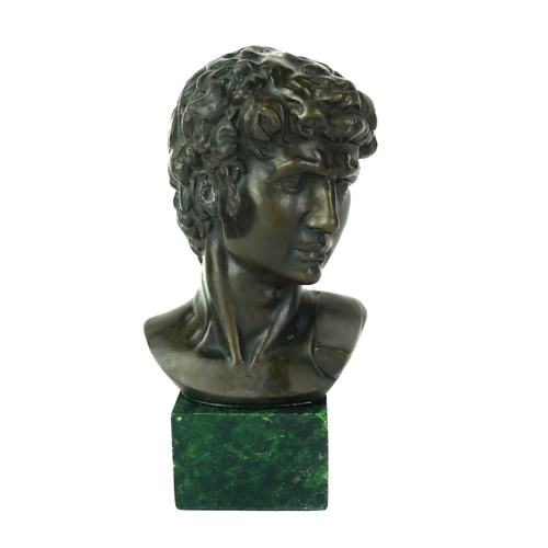 565 - A MODERN BRONZE BUST OF DAVID
Raised on a modern square green marble base.
(h 17cm)