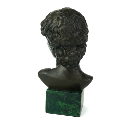 565 - A MODERN BRONZE BUST OF DAVID
Raised on a modern square green marble base.
(h 17cm)