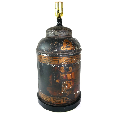 571 - AN ANTIQUE TOLEWARE TEA CANISTER LAMP
Decorated with chinoiserie figures near a harbour on black gro... 