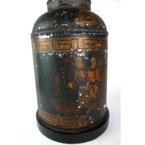 571 - AN ANTIQUE TOLEWARE TEA CANISTER LAMP
Decorated with chinoiserie figures near a harbour on black gro... 