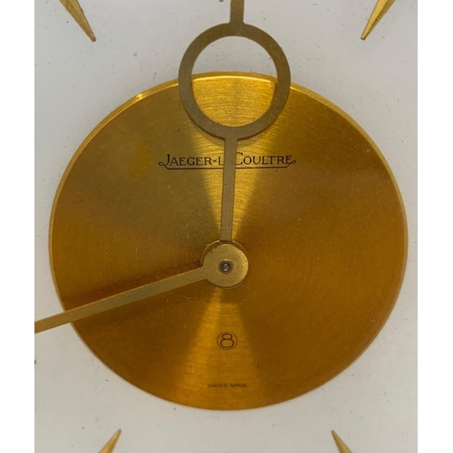 576 - JAEGER-LECOULTRE, A MID CENTURY CLOCK
With gilt metal chinoiserie decoration. 
(h 20cm x diameter 19... 