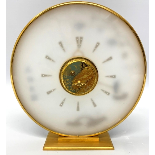 576 - JAEGER-LECOULTRE, A MID CENTURY CLOCK
With gilt metal chinoiserie decoration. 
(h 20cm x diameter 19... 