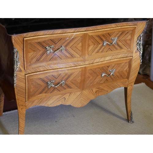 702 - A FRENCH KINGWOOD BOMBE CHEST OF TWO DRAWERS 
With later peach glass mirrored top.
(91cm x 50cm x 70... 