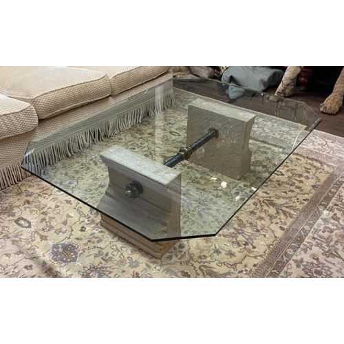 706 - A 20TH CENTURY COFFEE TABLE
With clear bevelled glass top supported on carved stone plinths, joined ... 