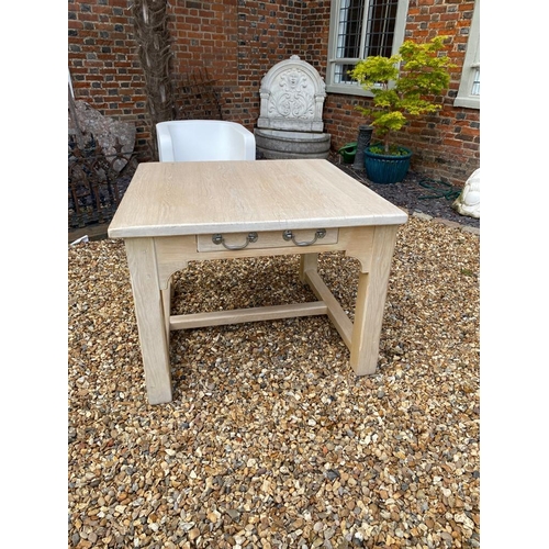 707 - A 20TH CENTURY LIMED OAK PREPARATION TABLE
The single drawer raised on heavy square chamfered legs j... 