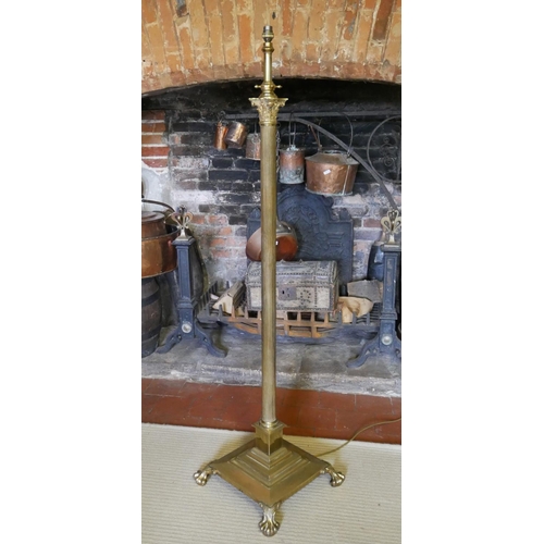 708 - A BRASS ADJUSTABLE STANDARD LAMP
With Corinthian capital on a fluted column and platform base termin... 