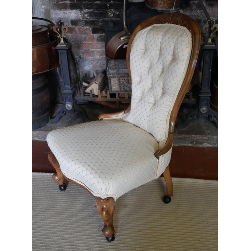 709 - A VICTORIAN MAHOGANY SPOON BACK NURSING CHAIR
Button back cream fabric upholstery, raised on cabriol... 