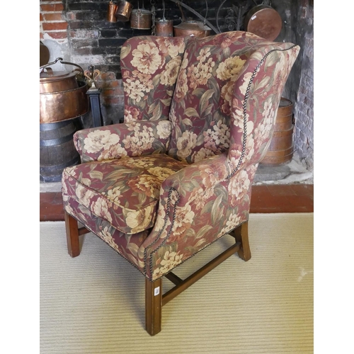 710 - A GEORGIAN STYLE WING ARMCHAIR
On chamfered legs, along with a stool.
(78cm x 81cm x 98cm)

Conditio... 