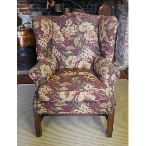 710 - A GEORGIAN STYLE WING ARMCHAIR
On chamfered legs, along with a stool.
(78cm x 81cm x 98cm)

Conditio... 