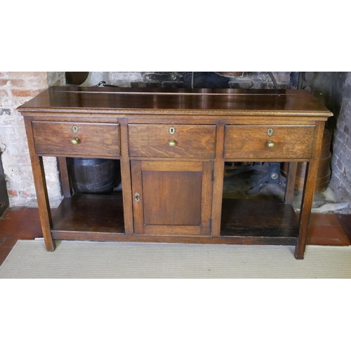 712 - A 19TH CENTURY OAK DRESSER
With three drawers above a central cupboard, on square legs.
(152cm x 50c... 