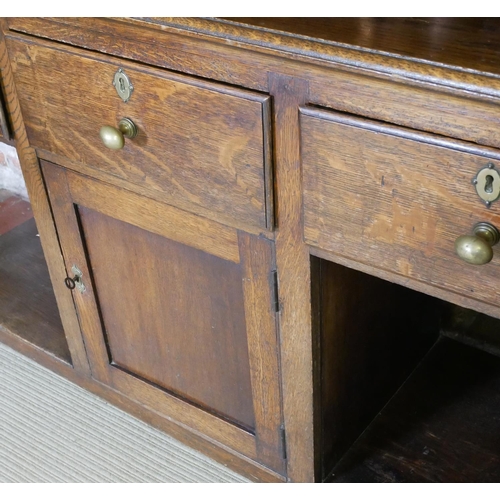 712 - A 19TH CENTURY OAK DRESSER
With three drawers above a central cupboard, on square legs.
(152cm x 50c... 